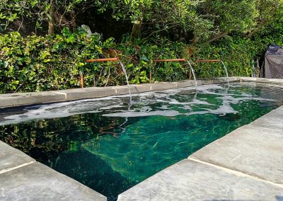 Modern minimalist water feature with clean lines, perfect for Durban gardens by Creative Landscapes